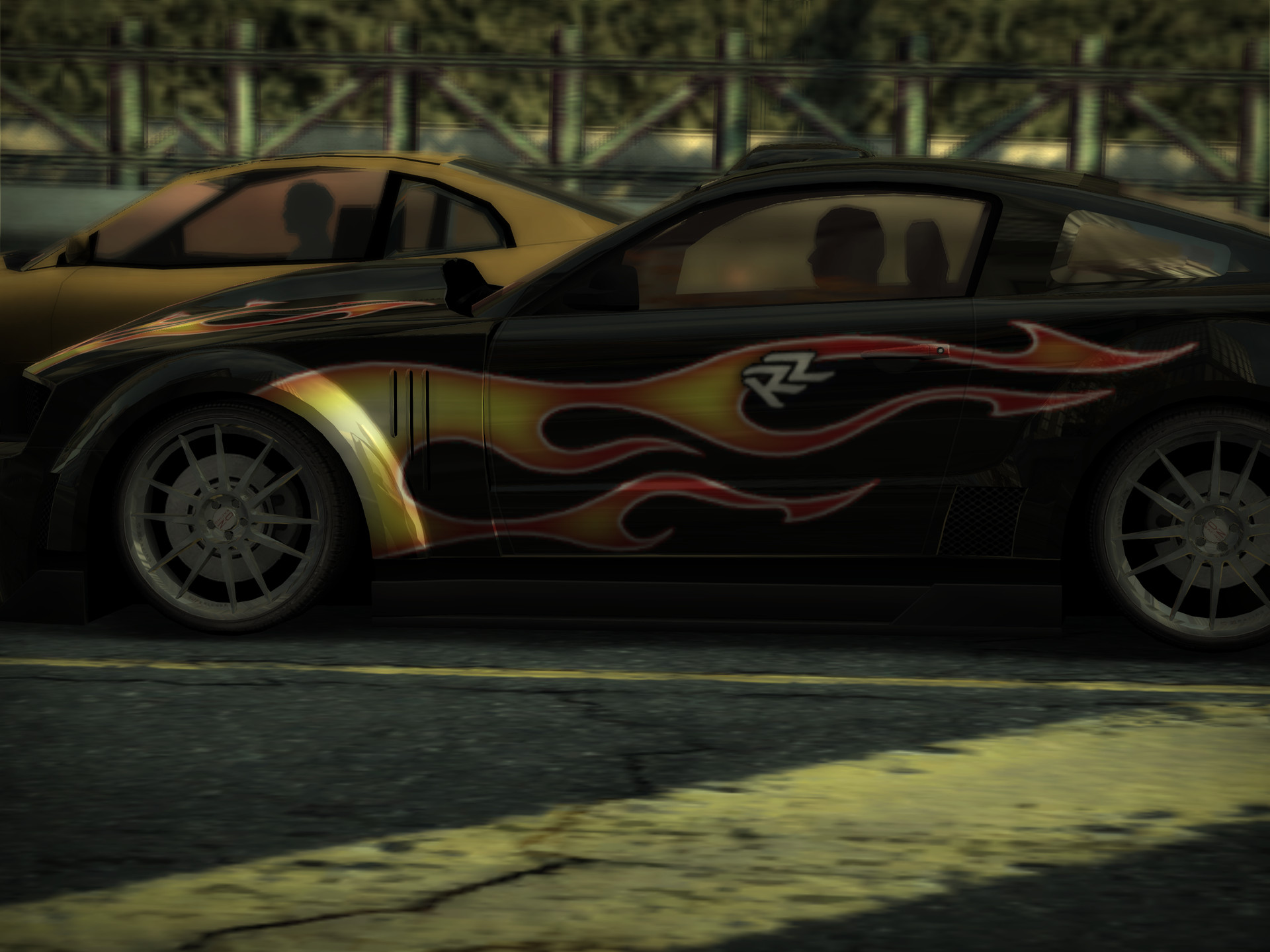 iPad shape, 4:3: a close side view of a black car with a flame livery