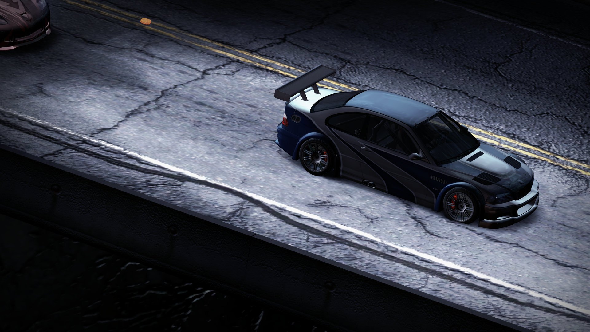 The prologue's canyon road, seen from above: the BMW M3 GTR on the cliff edge